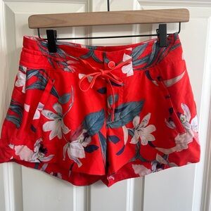 Like new Athleta size 2 Hudson Swim Shorts. Bright red with Hawaiian print.